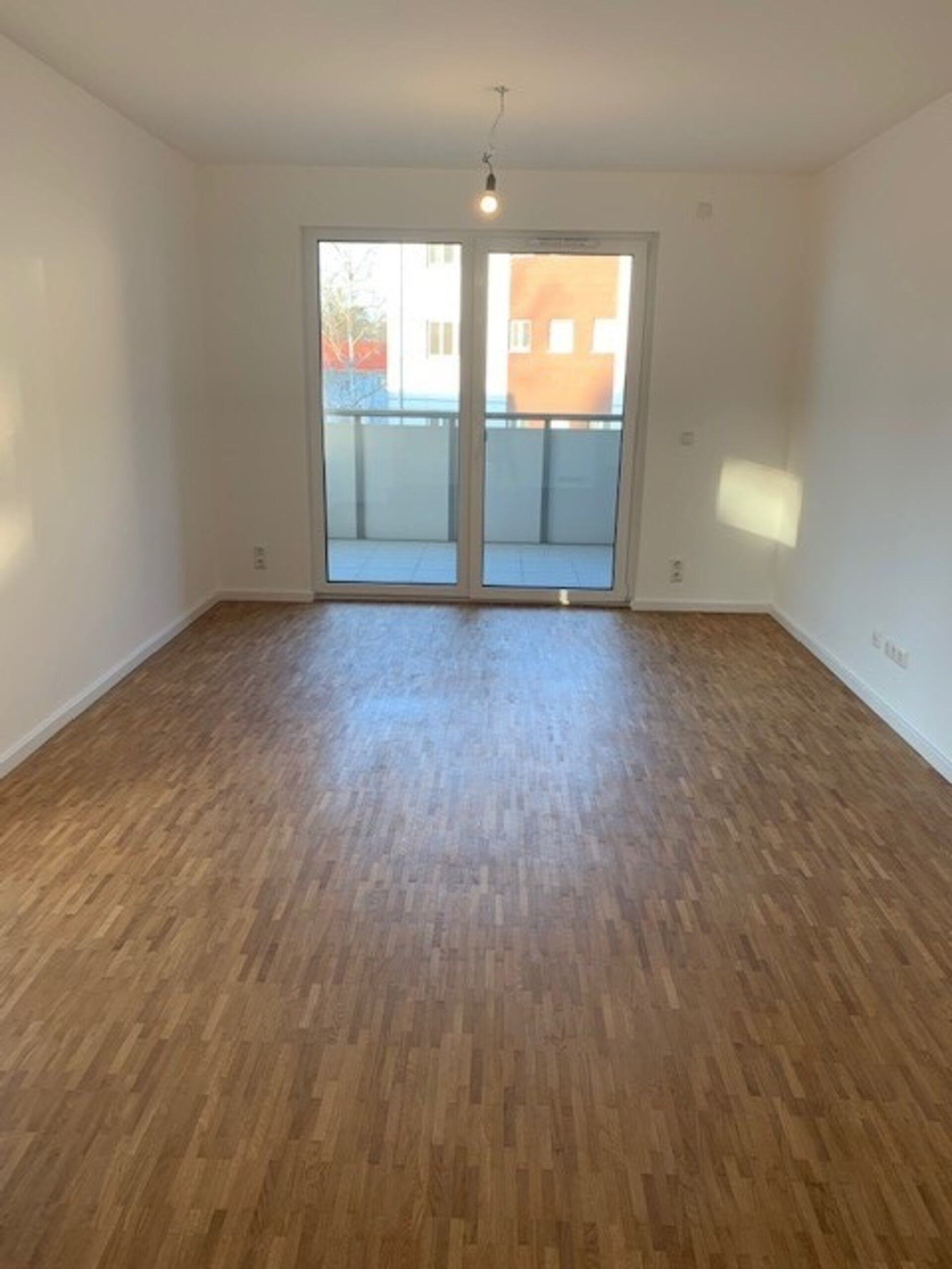 Wohnzimmer mit Balkon | © Dawonia