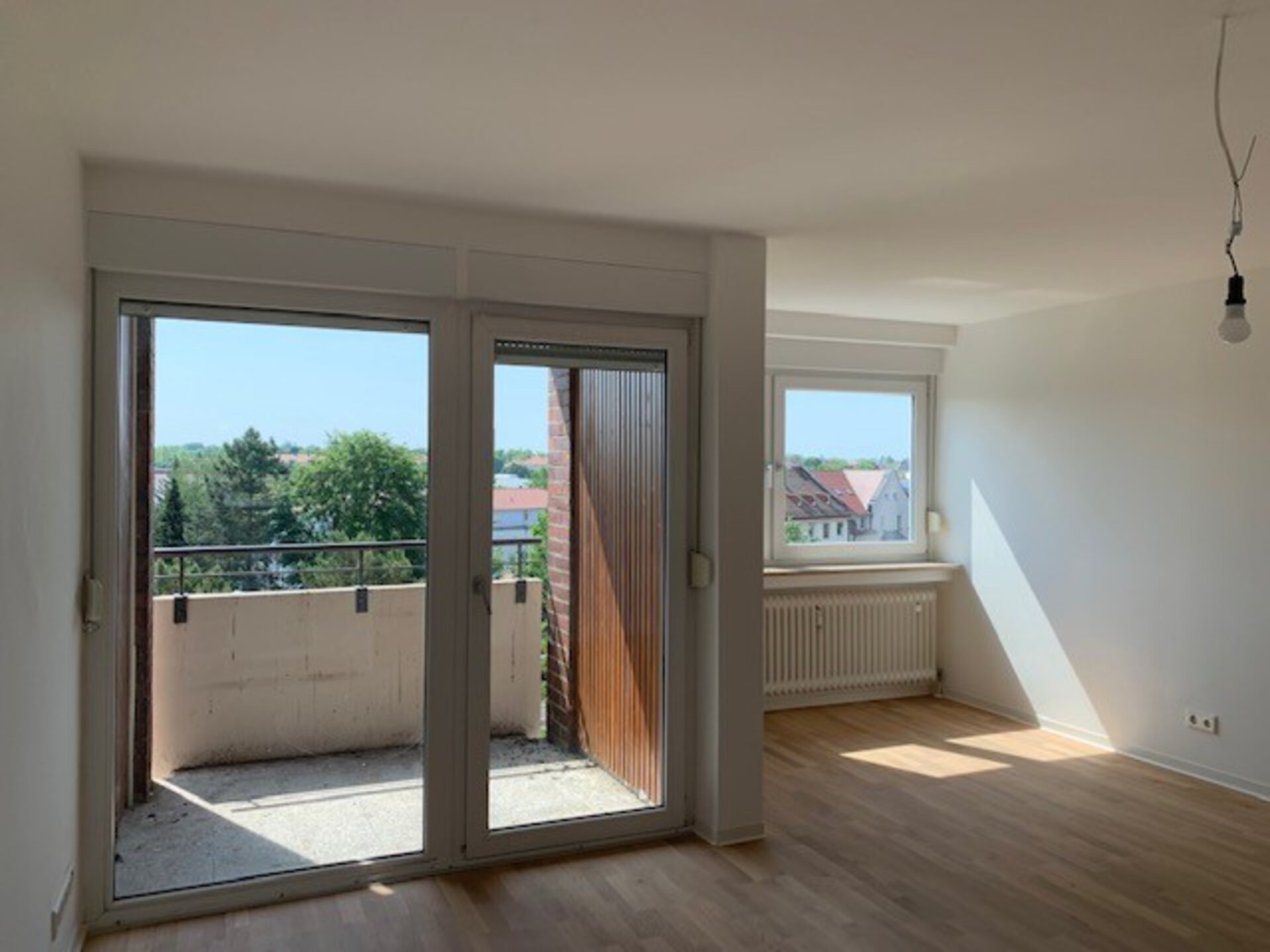 Wohnzimmer mit Balkon | © Dawonia