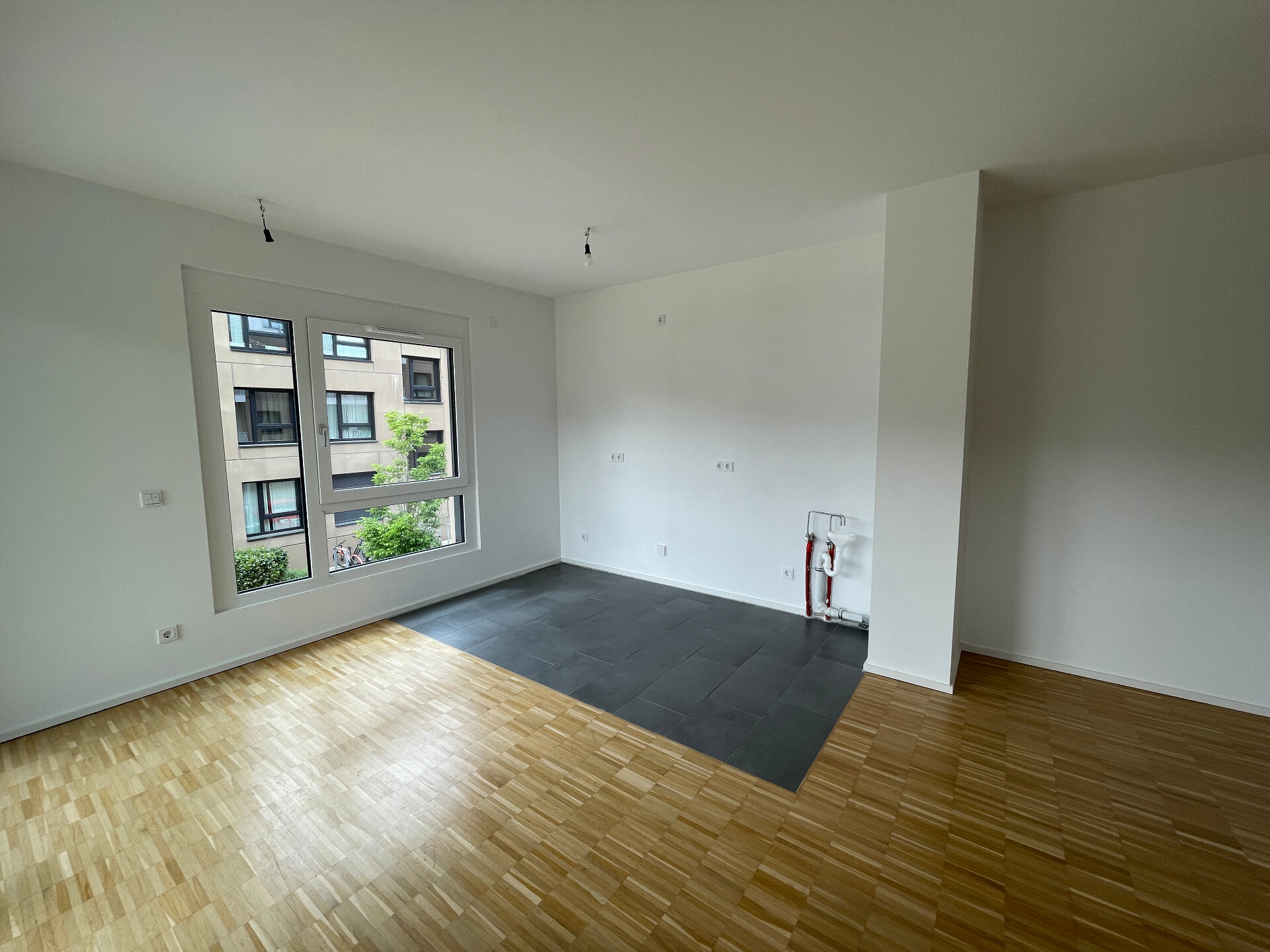 Wohnzimmer/offene Küche | © Dawonia